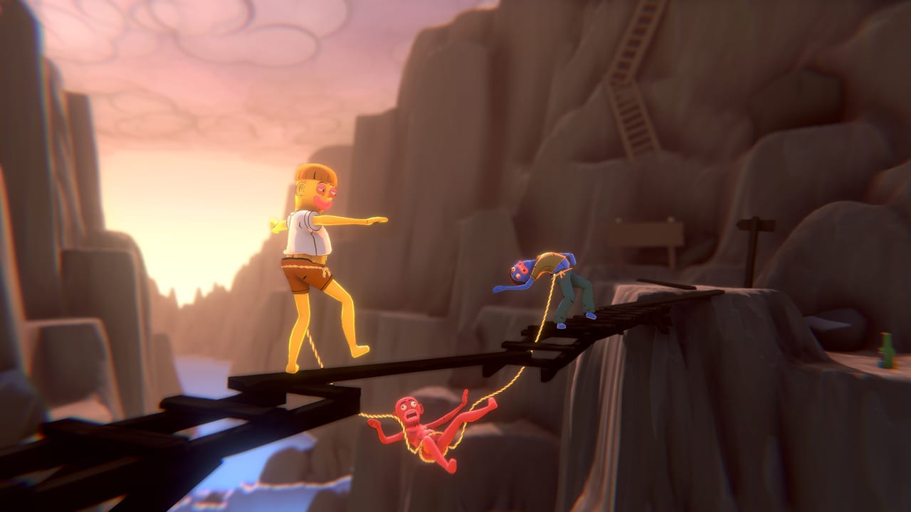 Three Friendly Steps players on a broken night bridge, one dangling from the shared rope